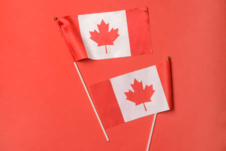Canadian flags on red background