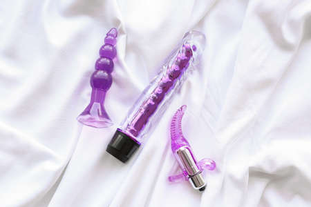 Different sex toys on bedの写真素材