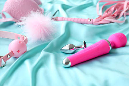 Different sex toys on bedの写真素材