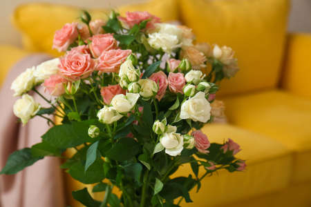 Bouquet of beautiful fresh roses in room, closeupの写真素材