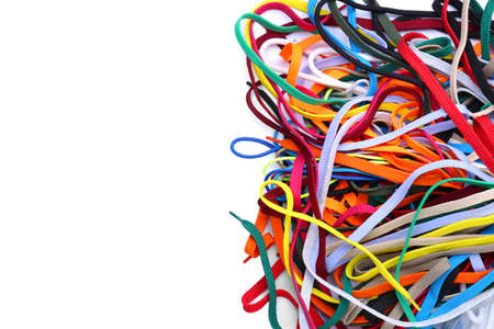 Heap of different shoe laces on white background