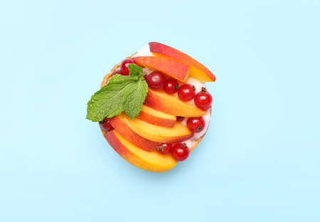 Tasty tart with fruits and berries on color background
