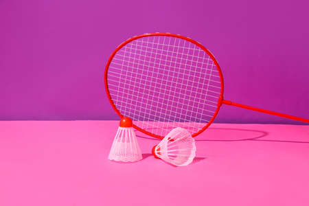 Badminton racket and shuttlecocks on color backgroundの写真素材