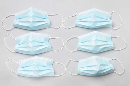 Surgical masks on light background
