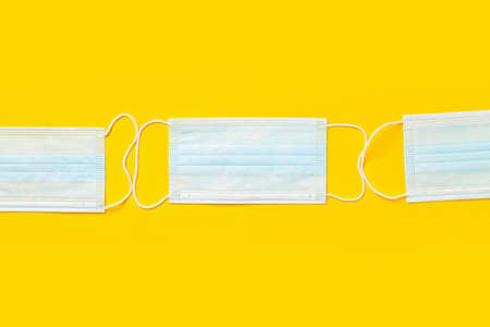 Surgical masks on color backgroundの写真素材