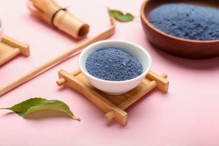 Composition with powdered blue matcha tea on color backgroundの写真素材