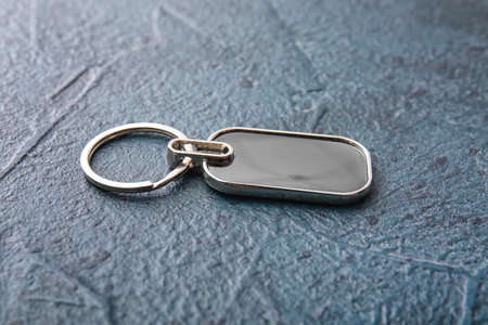 Stylish metallic keychain on dark backgroundの写真素材