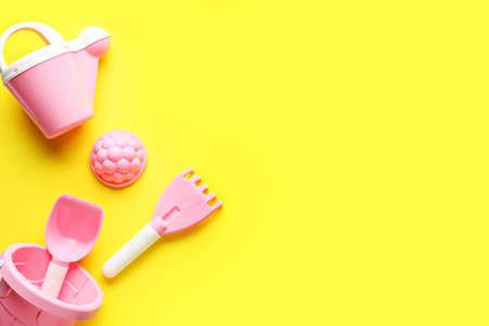 Set of beach accessories for children on color background