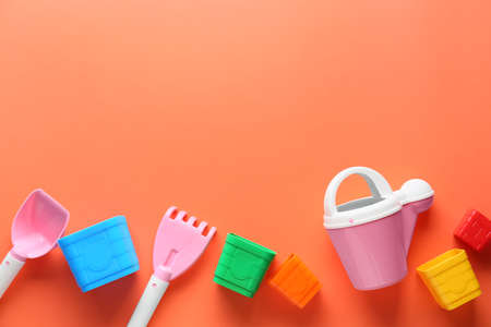 Set of beach accessories for children on color background