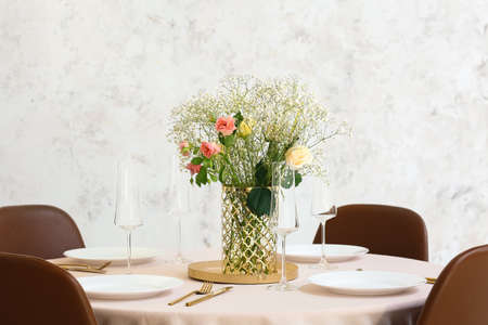 Beautiful table setting for wedding celebration in restaurantの写真素材