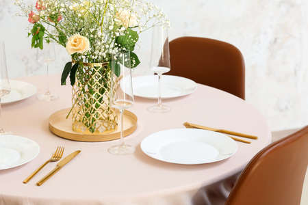 Beautiful table setting for wedding celebration in restaurantの写真素材