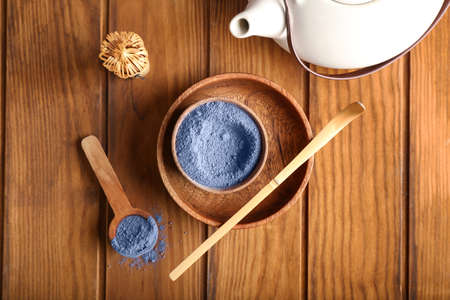 Composition with powdered blue matcha tea on wooden backgroundの写真素材
