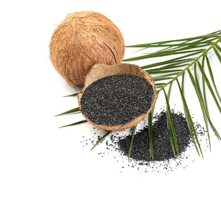 Coconut shell with activated carbon on white backgroundの写真素材