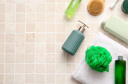 Set of different bath supplies on light tile, closeupの写真素材