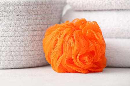 Soft orange sponge on table, closeupの写真素材