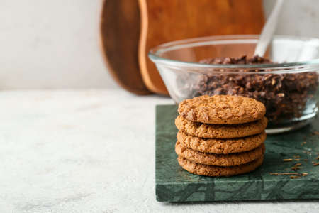 Board with tasty hojicha cookies on table