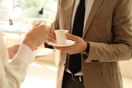 business people having coffee break in officeの写真素材