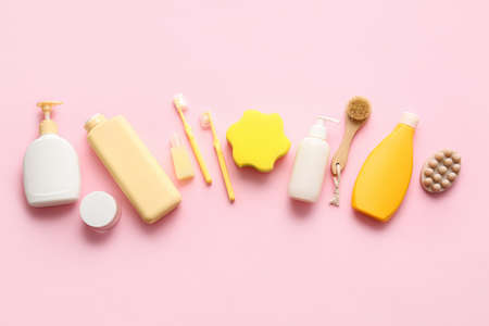 Set of cosmetic products and different bath accessories on pink backgroundの写真素材