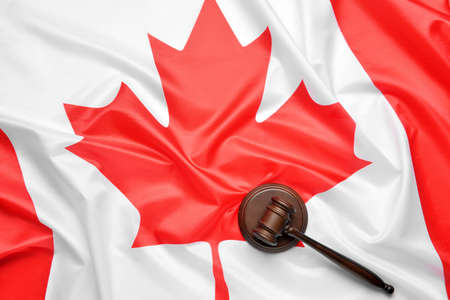 Judge's gavel on flag of Canadaの写真素材