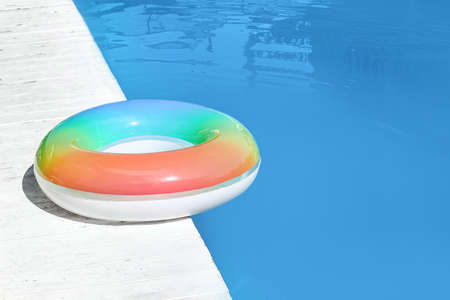 Inflatable ring on edge of swimming poolの写真素材