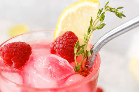 Glass of tasty raspberry lemonade, closeupの写真素材