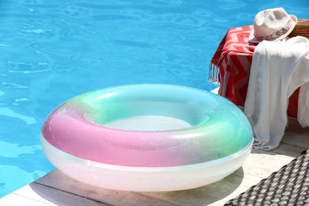 Inflatable ring on edge of swimming pool