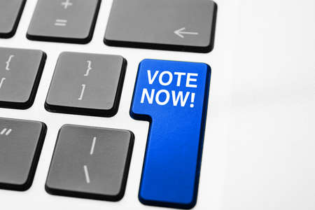 Button with text VOTE NOW on computer keyboard, closeupの写真素材