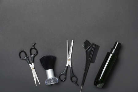 Set of hairdresser's tools on dark background