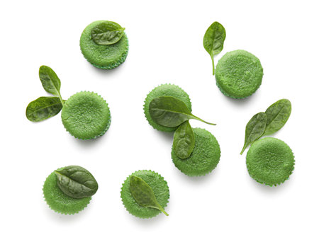Tasty spinach muffins on white backgroundの写真素材