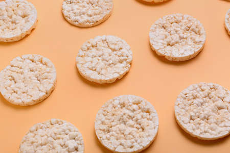 Crispy corn crackers on color backgroundの写真素材