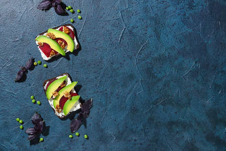 Tasty vegetarian bruschettas on dark backgroundの写真素材