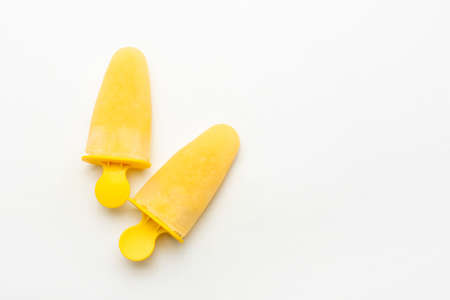 Tasty pineapple ice creams on white background