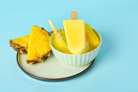 Bowl with tasty pineapple ice-cream
 on color background