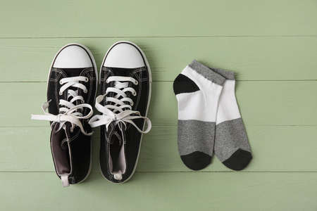 Stylish shoes and socks on wooden backgroundの写真素材