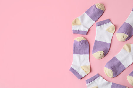 Many socks on pink background, close upの写真素材