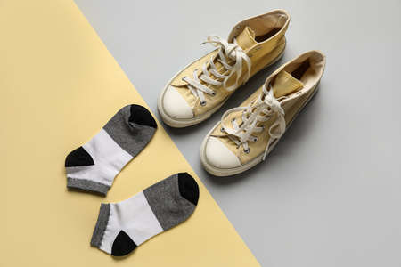 Stylish shoes and socks on color backgroundの写真素材