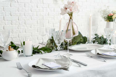 Beautiful table setting for wedding celebration in restaurantの写真素材