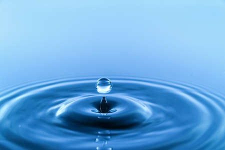 splash of water on blue background