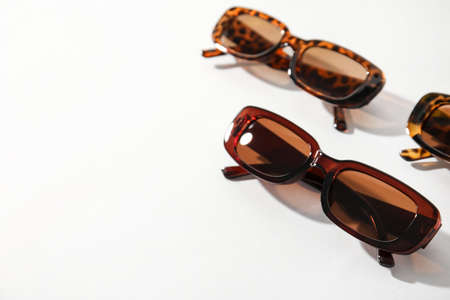 Different female sunglasses on white background