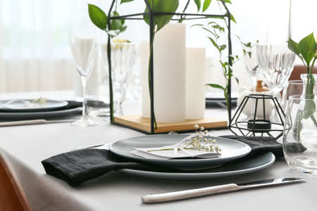 Beautiful table setting for wedding celebration in restaurantの写真素材