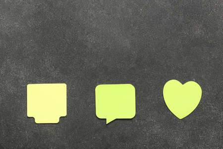 Yellow sticky notes on dark backgroundの写真素材