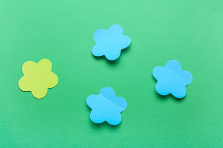 Sticky note papers on green background