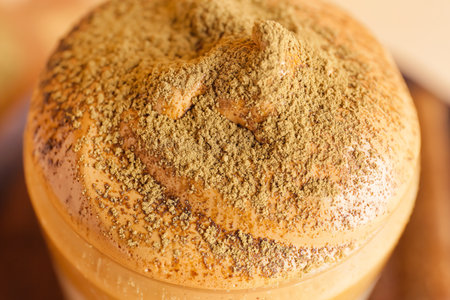 Glass of tasty dalgona hojicha latte on table, closeupの写真素材