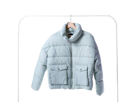 Rack with modern down jacket on white backgroundの写真素材