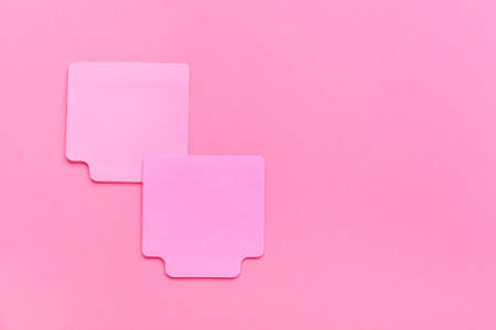 Sticky note papers on pink backgroundの写真素材