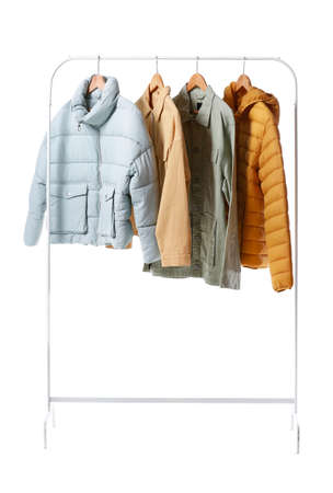 Rack with stylish jackets on white backgroundの写真素材