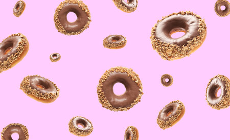 Many flying chocolate donuts on pink background