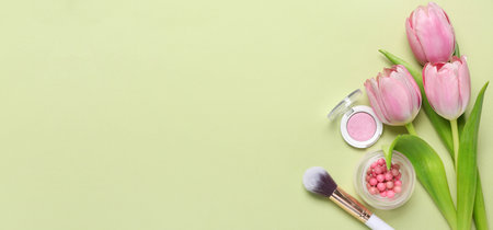 Decorative cosmetics and tulips on color background with space for text. mother's day celebrationの写真素材