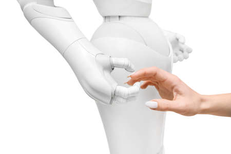Hands of woman and futuristic humanoid robot on white background, closeupの写真素材