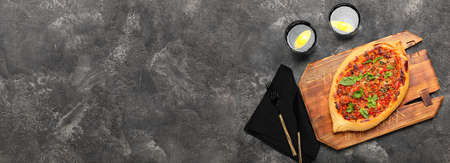 Tasty Turkish Pizza on dark background with space for textの写真素材